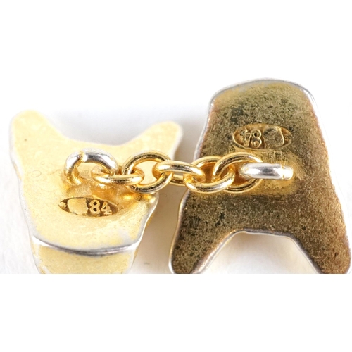 3116 - A pair of silver gilt French Bulldog design cufflinks with red stone eyes, impressed Russian marks, ... 