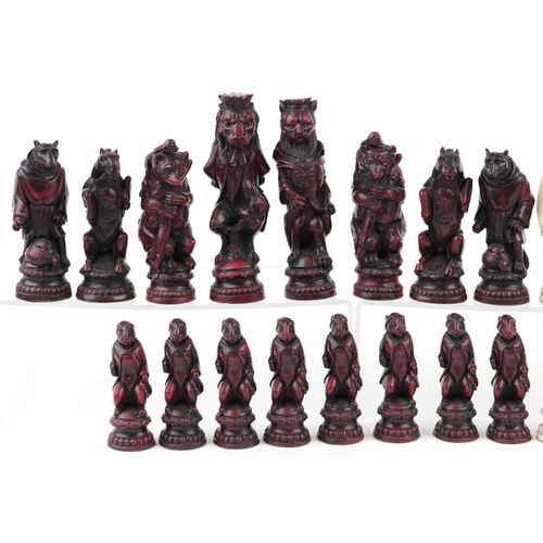 1341 - A decorative resin chess set in the form of animals, the largest piece 17cm high.