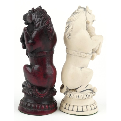 1341 - A decorative resin chess set in the form of animals, the largest piece 17cm high.