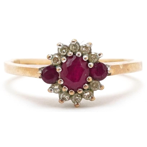 3469 - A 9ct gold ruby and diamond cluster ring, size P, 2.6g.