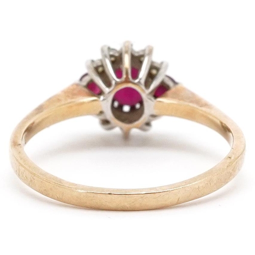 3469 - A 9ct gold ruby and diamond cluster ring, size P, 2.6g.