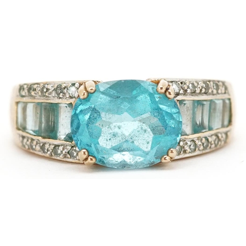 3152 - A 9ct gold blue topaz and diamond ring, size O, 4.4g.