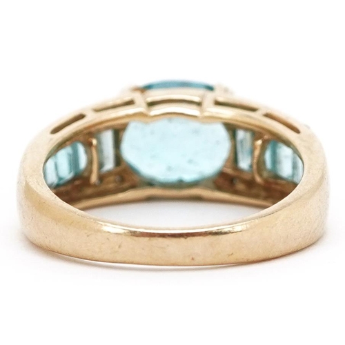 3152 - A 9ct gold blue topaz and diamond ring, size O, 4.4g.