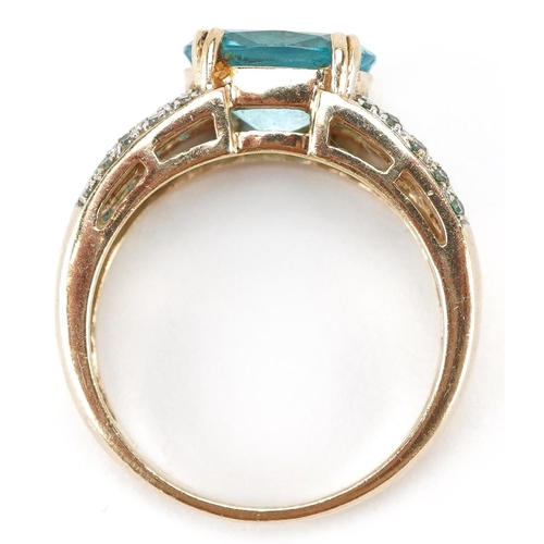 3152 - A 9ct gold blue topaz and diamond ring, size O, 4.4g.