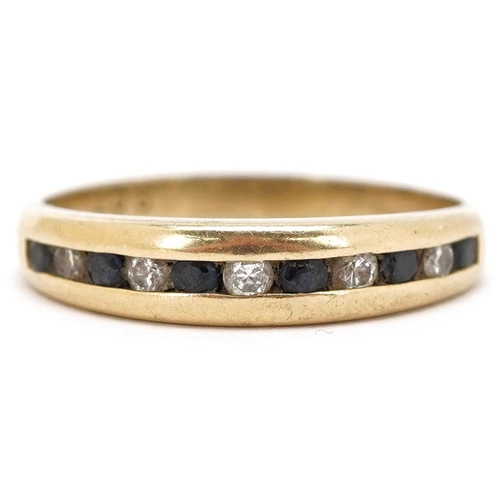 3377 - A 9ct gold black spinel and diamond half eternity ring, size O, 2.4g.