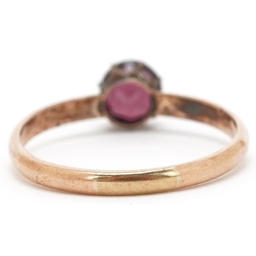 3106 - A 9ct gold garnet solitaire ring, size U, 2.1g.