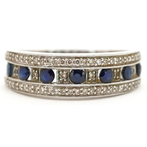 3111 - A 9ct white gold sapphire and diamond half eternity ring, size P, 3.2g.