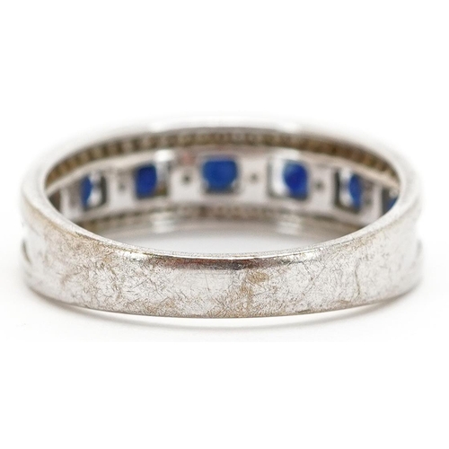 3111 - A 9ct white gold sapphire and diamond half eternity ring, size P, 3.2g.