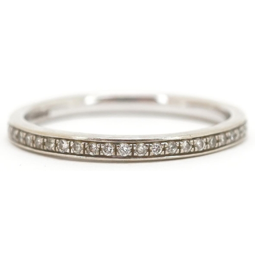 3113 - An unmarked 9ct white gold diamond eternity ring, size P, 1.8g.