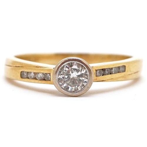 3446 - An 18ct gold diamond solitaire ring set with diamond set shoulders, total diamond weight approximate... 