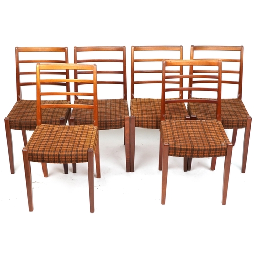 2031 - A mid/late 20th century G Plan teak extending dining table with single extra leaf, together with six... 