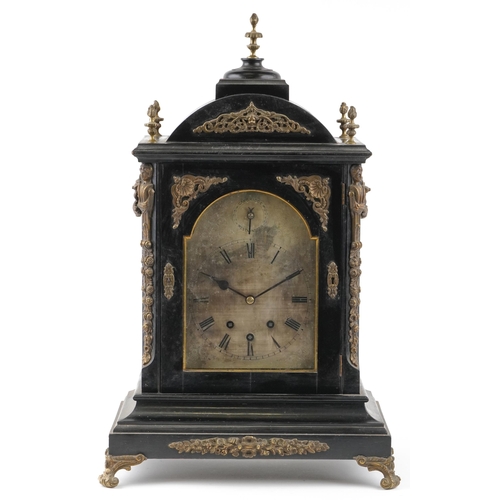  A large ebonised and gilt metal mounted mantle clock, the silvered dial having black Roman numerals,... 