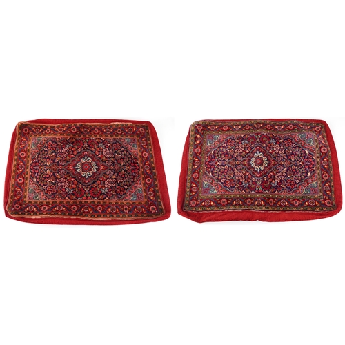 219 - A pair of large Iranian style cushion covers, late 20th century, each with a central medallion flank... 