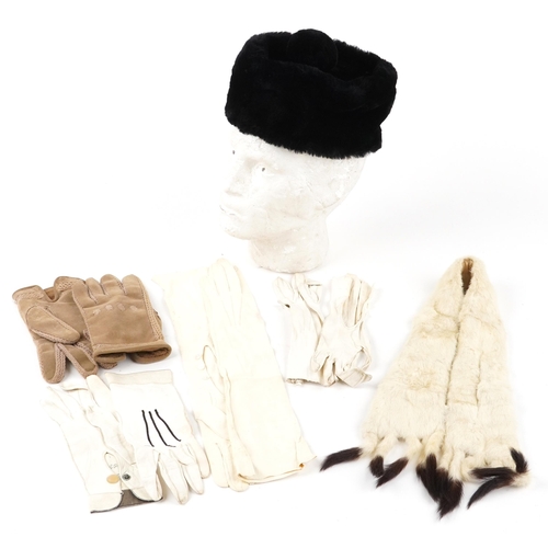 1015 - Three pairs of early 20th century ladies white leather gloves together with a white mink fur stole a... 