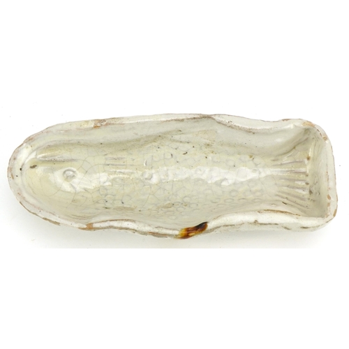 438 - A late 19th century French naive stoneware fish mould, modelled with a scaly fish and beige glaze, L... 