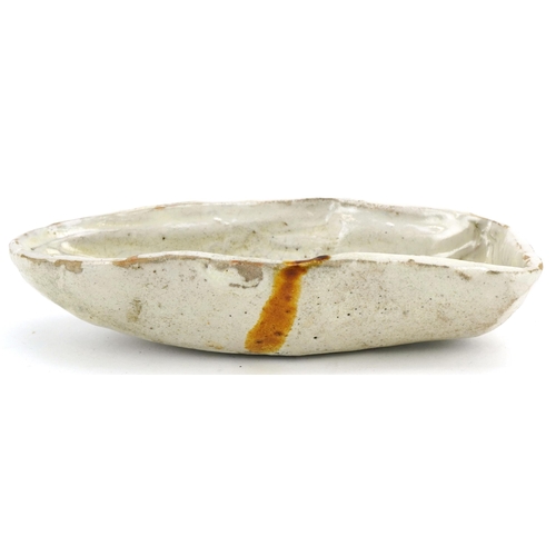 438 - A late 19th century French naive stoneware fish mould, modelled with a scaly fish and beige glaze, L... 