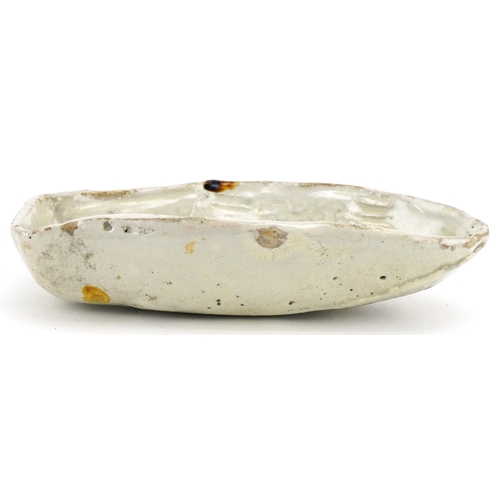 438 - A late 19th century French naive stoneware fish mould, modelled with a scaly fish and beige glaze, L... 