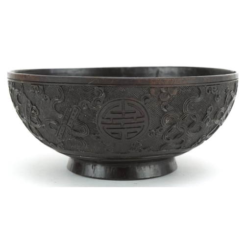 415 - A finely carved Chinese Coconut Bowl, late 19th/ early 20th century, the sides carved with intricate... 