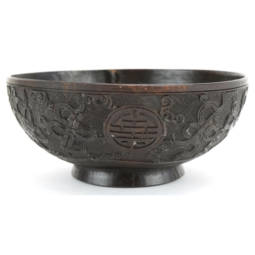 415 - A finely carved Chinese Coconut Bowl, late 19th/ early 20th century, the sides carved with intricate... 