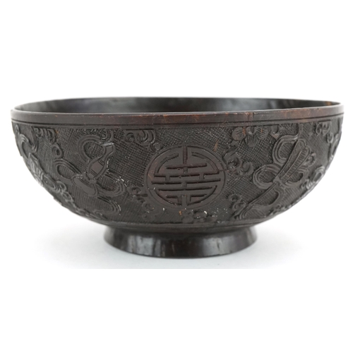 415 - A finely carved Chinese Coconut Bowl, late 19th/ early 20th century, the sides carved with intricate... 