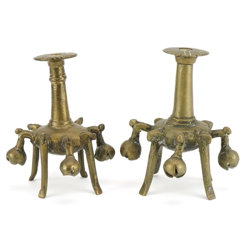 198 - Two unusual bronze Kohl sticks, early 20th century, of candlestick form, the sconce pierced and engr... 