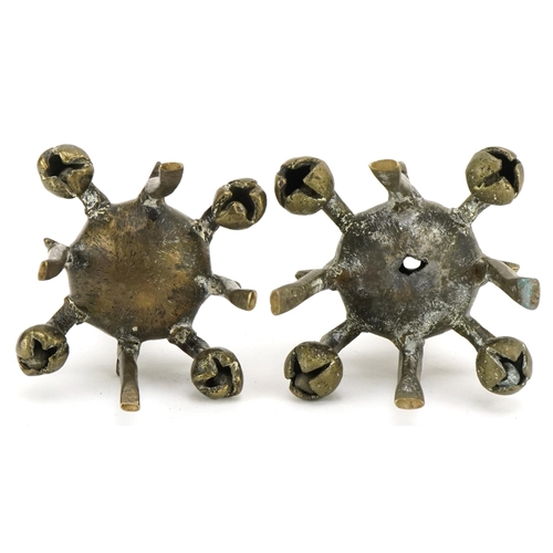 198 - Two unusual bronze Kohl sticks, early 20th century, of candlestick form, the sconce pierced and engr... 