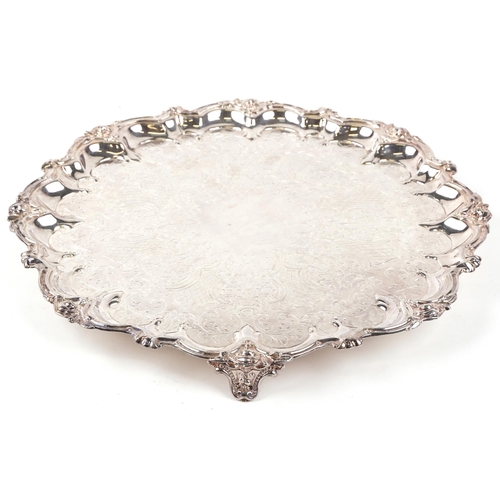 1136 - A Victorian electro plated salver, circa 1880, with an elabrate C & S scroll border, on beaded brack... 