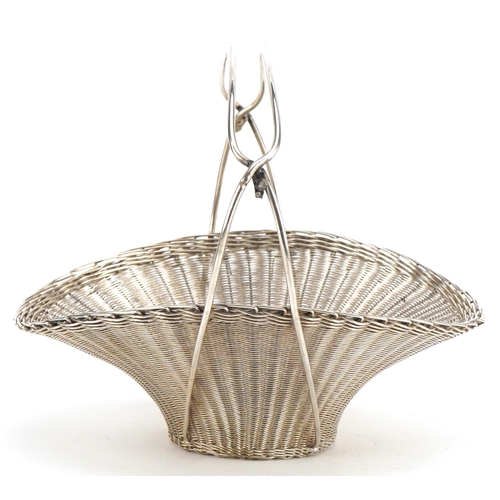 308 - A Chinese silver finely woven bonbon basket, circa 1900, with a wirework overhead handle, finely wov... 