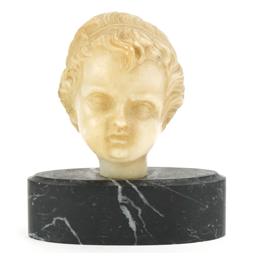 327 - A 19th century carved alabaster bust of a putto, circa 1880 now as a Presse Papier, the youth with r... 