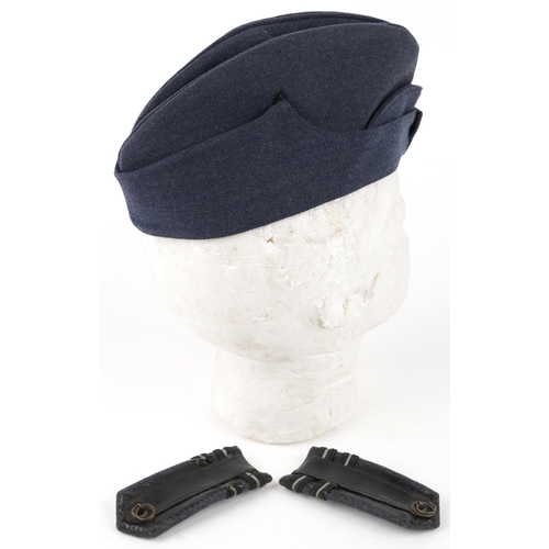 2478 - RAF military officer's side cap dated 1945 and a pair of shoulder badges.