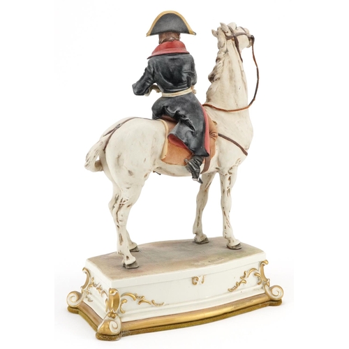 469 - A mid 20th century Capodimonte porcelain figure of Napoleon on horseback, signed Bruno Merli, 34cm h... 