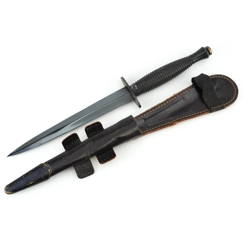 2518 - A British military interest Fairbairn Sykes style Commando dagger with leather sheath.