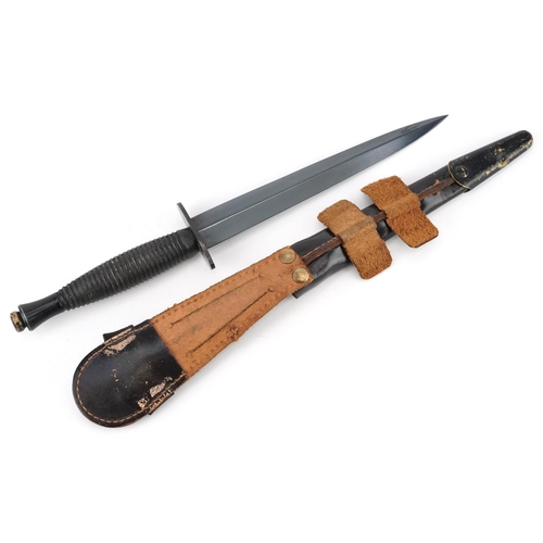 2518 - A British military interest Fairbairn Sykes style Commando dagger with leather sheath.