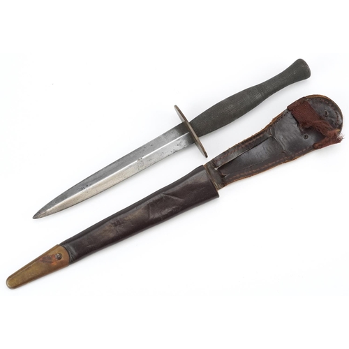 2522 - A British military Fairbairn Sykes style Commando dagger with leather sheath, 32cm in length.