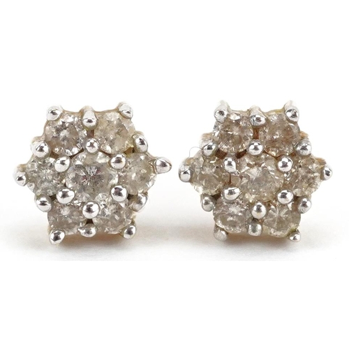 3136 - A pair of 9ct gold diamond flower head stud earrings, 6.3mm high, total 1.2g.