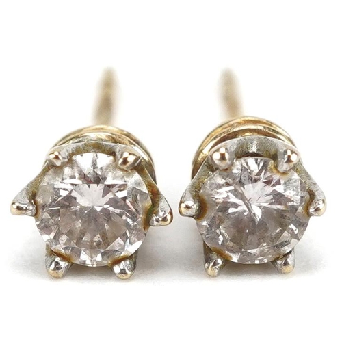 3414 - A pair of 9ct gold diamond solitaire stud earrings, the diamond 4.23mm in diameter, total 1.1g.