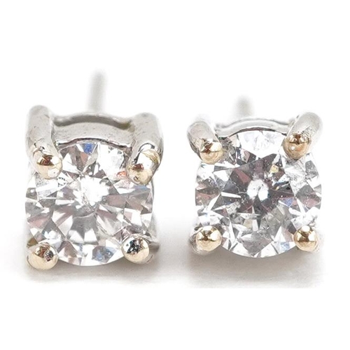 3089 - A pair of 14ct white gold diamond stud earrings, 4.20mm in diameter, total 1.7g.