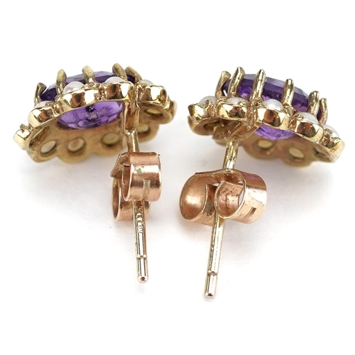 3219 - A pair of 9ct gold amethyst and seed pearl stud earrings, 11.5mm high, total 2.2g.