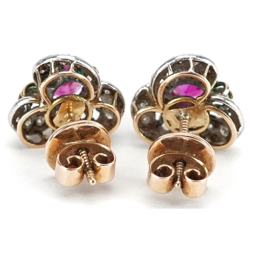 3040 - A pair of 18ct gold ruby and diamond stud earrings with screw on backs, 11.9mm high, total 4.6g.