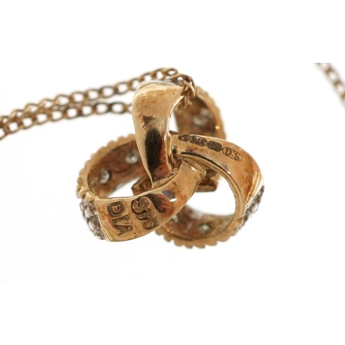 3344 - A 9ct gold diamond love knot pendant on a 9ct gold chain, 9.0mm high and 44cm in length, total 1.3g.