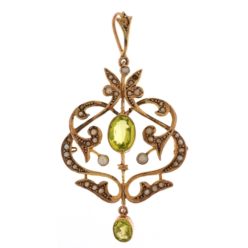 3138 - An Edwardian unmarked gold peridot and seed pearl openwork pendant, 53.3mm high, 3.5g.