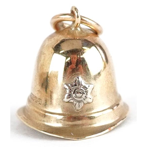 3653 - A 9ct gold charm in the form of a Police helmet, 14.8mm wide, 1.2g.