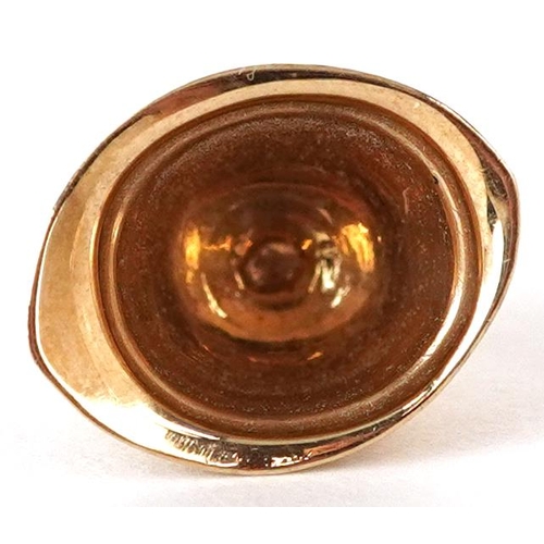 3653 - A 9ct gold charm in the form of a Police helmet, 14.8mm wide, 1.2g.