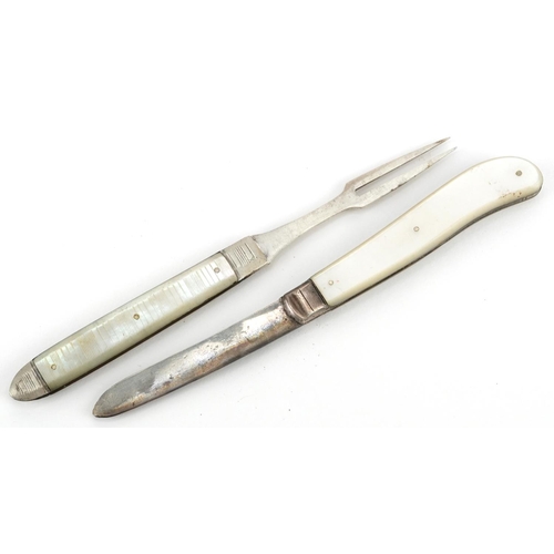 128 - An Edwardian silver and mother of pearl folding fruit knife and fork, the knife Sheffield 1902, the ... 