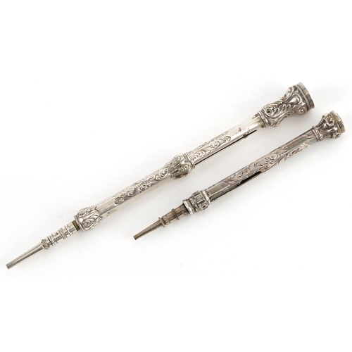 267 - Two Edwardian unmarked silver propelling pencils with citrine terminals, the largest 9.5cm in length... 