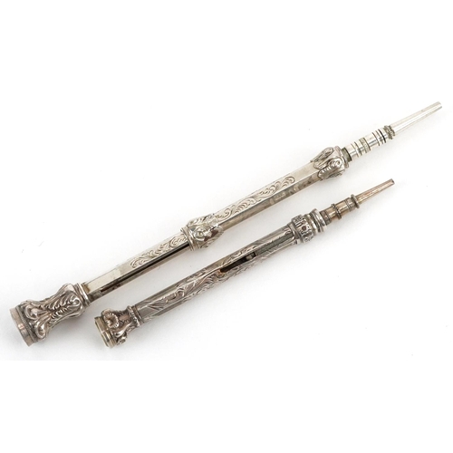 267 - Two Edwardian unmarked silver propelling pencils with citrine terminals, the largest 9.5cm in length... 