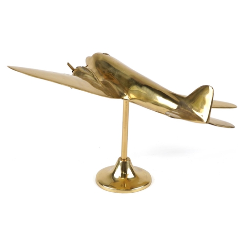 2457 - An early 20th century polished brass desk stand of a twin propeller aeroplane on a circular plinth b... 