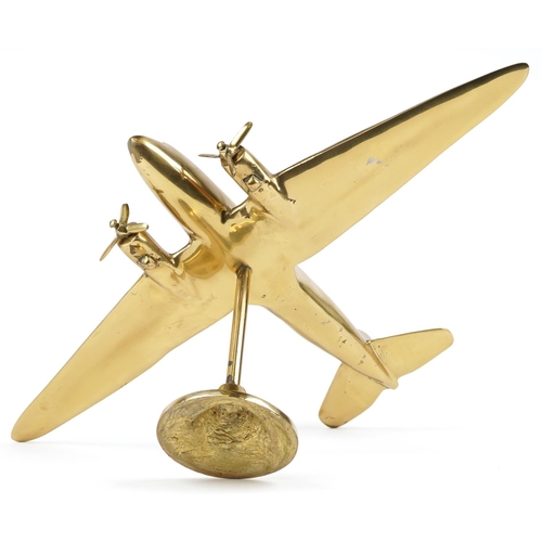 2457 - An early 20th century polished brass desk stand of a twin propeller aeroplane on a circular plinth b... 