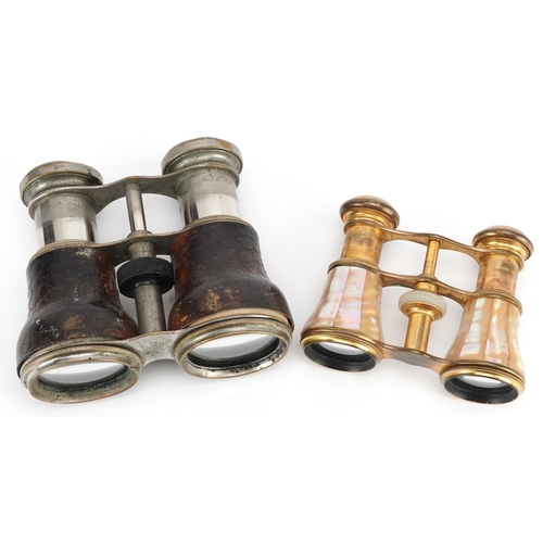 1007 - A pair of early 20th century French Le Jockey Club binoculars, 11cm wide, together with a pair of mo... 