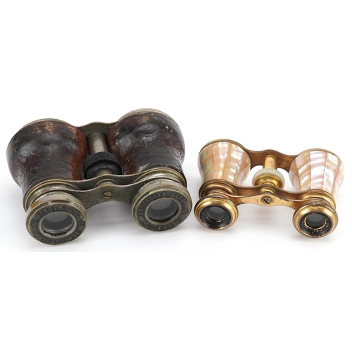 1007 - A pair of early 20th century French Le Jockey Club binoculars, 11cm wide, together with a pair of mo... 